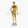 Mannequin de vitrine femme en plastique or brillant avec tête abstraite